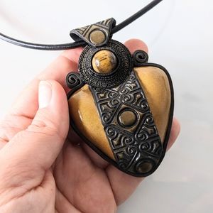 Necklace pendant with Celtic ornament and tiger eye